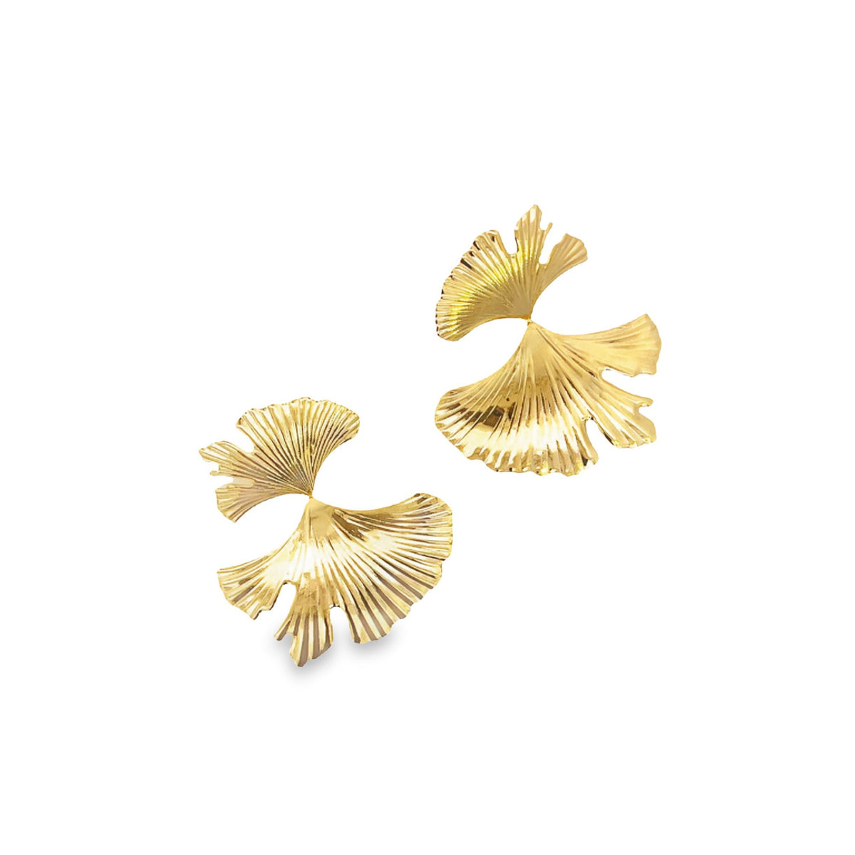 A pair of shiny gold ginkgo leaf earrings glimmers against a clean white background.