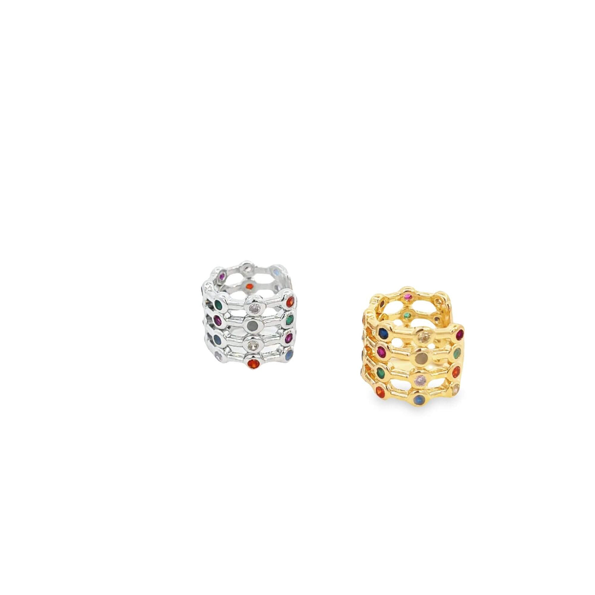 Two multi-band ear cuffs encrusted with colorful cubic zirconia stones sit side by side on a white surface.