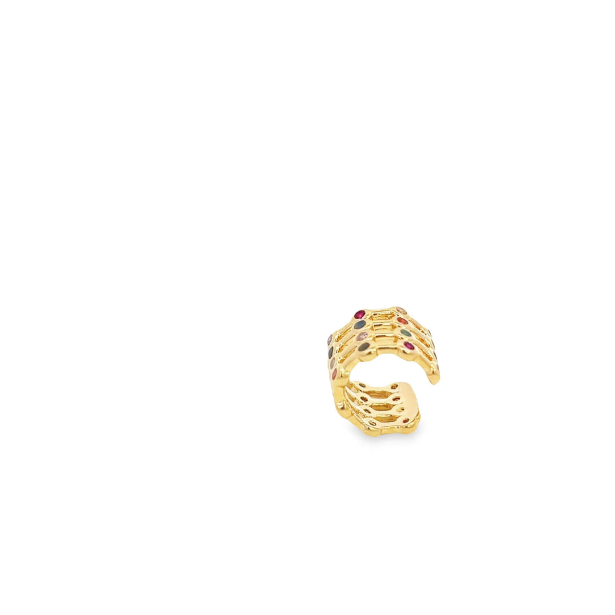 A gold multi-band ear cuff sparkles with colorful gemstone accents against a plain white background.