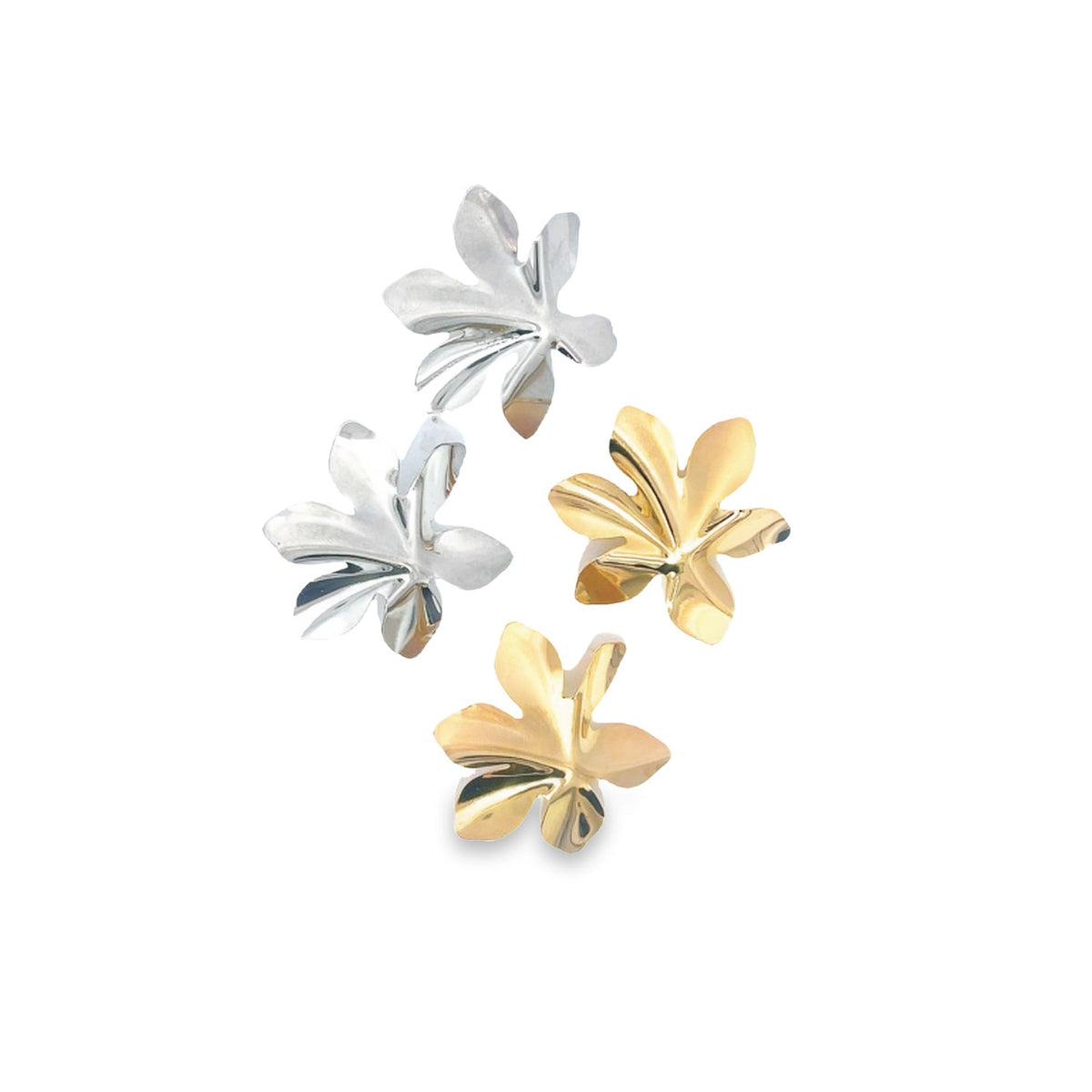 Four metallic leaf-shaped stud earrings in silver and gold finishes rest against a plain white background.