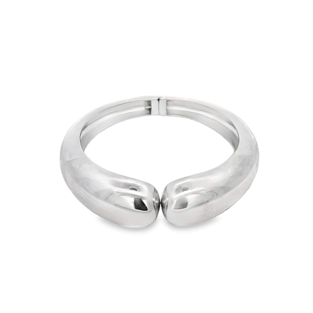 A sleek, silver hinged cuff bracelet with a thick, teardrop-shaped front rests against a clean white background.