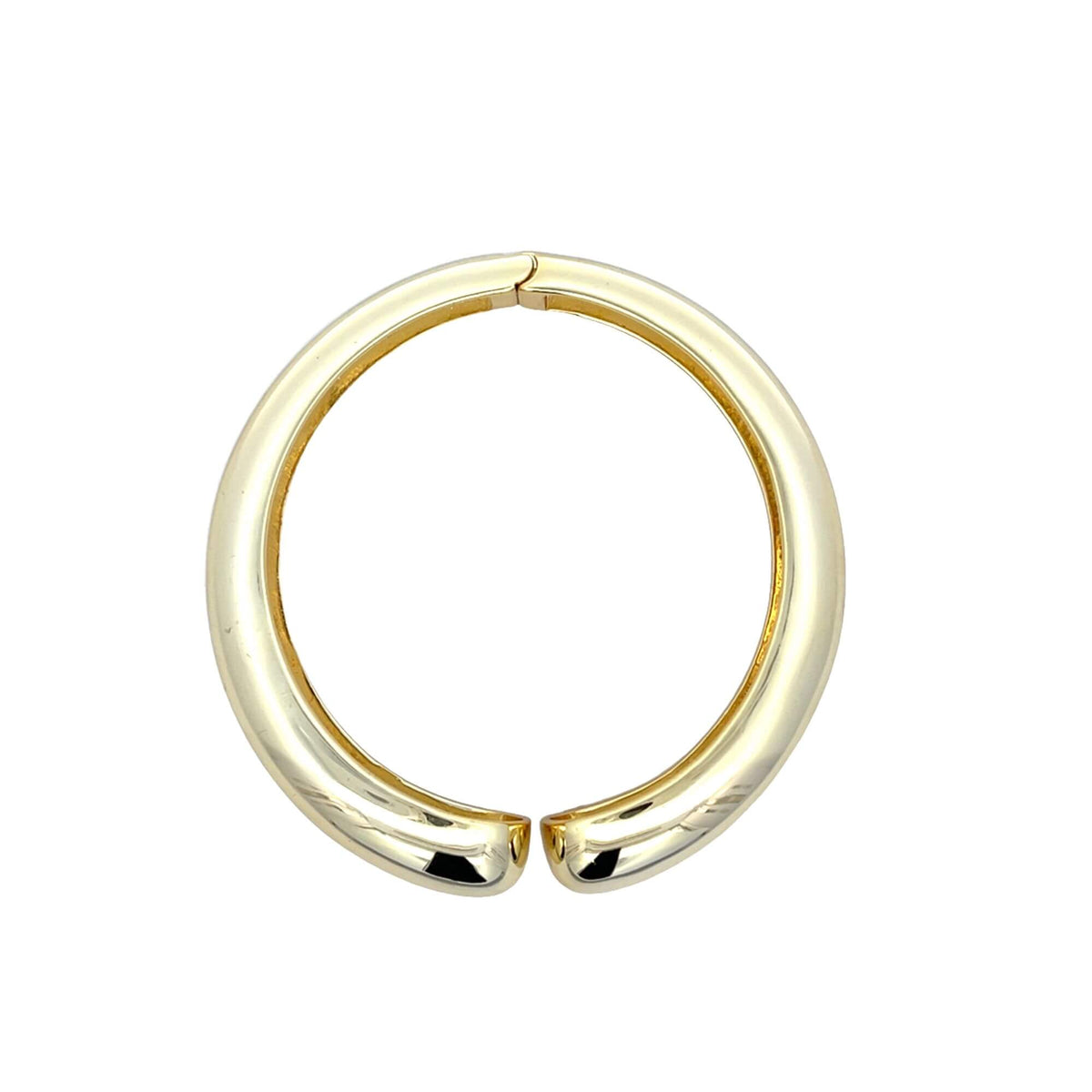 A thick, polished gold hoop earring rests centered on a pure white background.