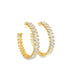 A pair of gleaming gold hoop earrings features a continuous row of sparkling baguette-cut diamonds.