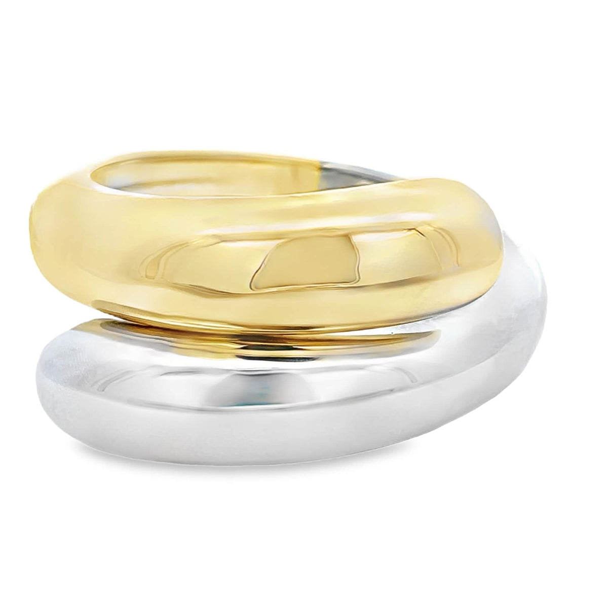 A modern two-tone ring features a bold, chunky gold band resting on top of a polished silver band against a clean white background.