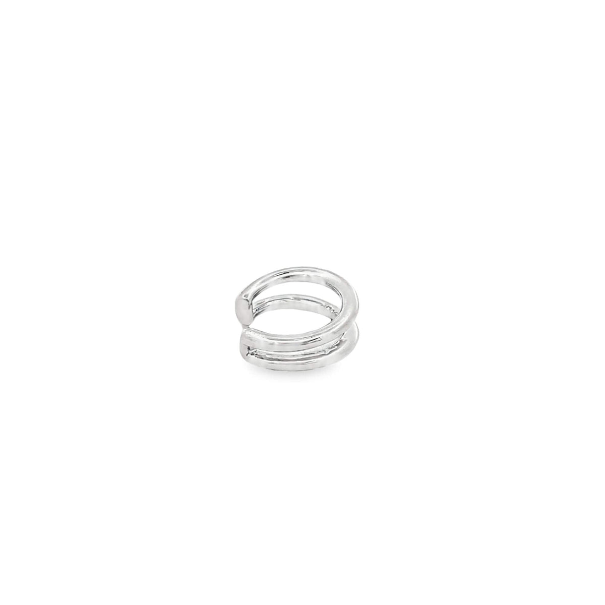A sleek silver double-band ear cuff sits isolated on a clean white background.