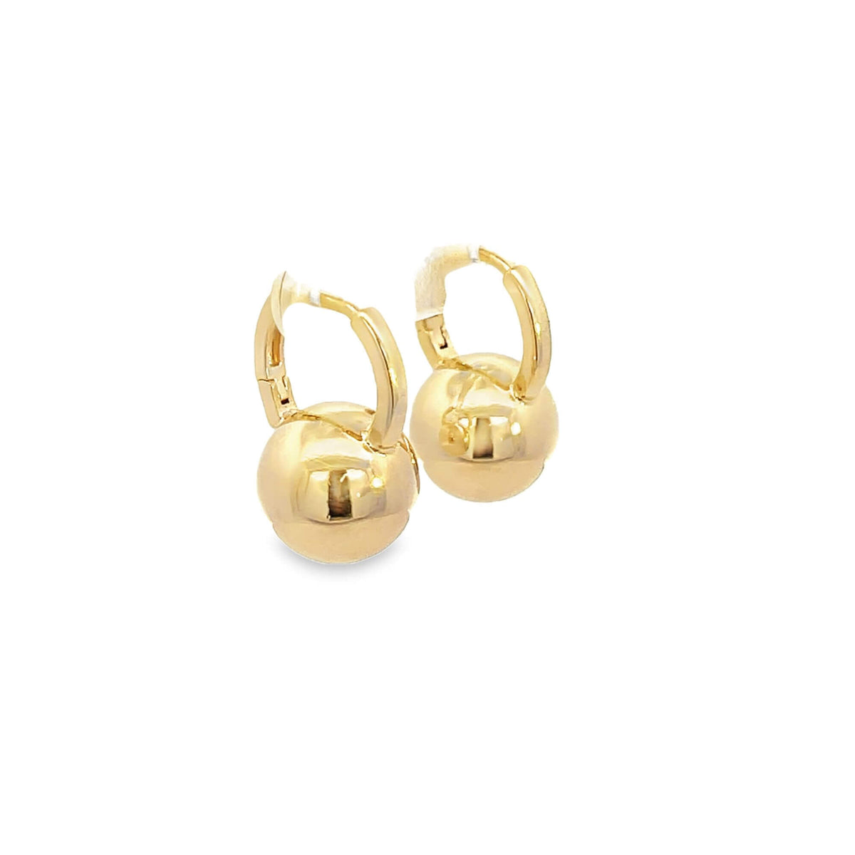 A pair of polished gold ball drop hoop earrings gleams against a white background.
