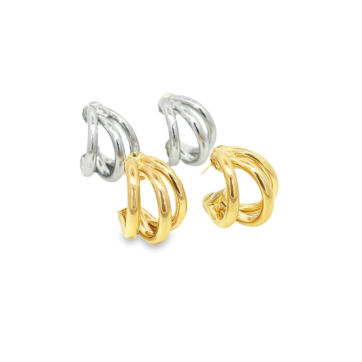 Two pairs of triple-hoop earrings in polished gold and silver sit side by side against a clean white background.