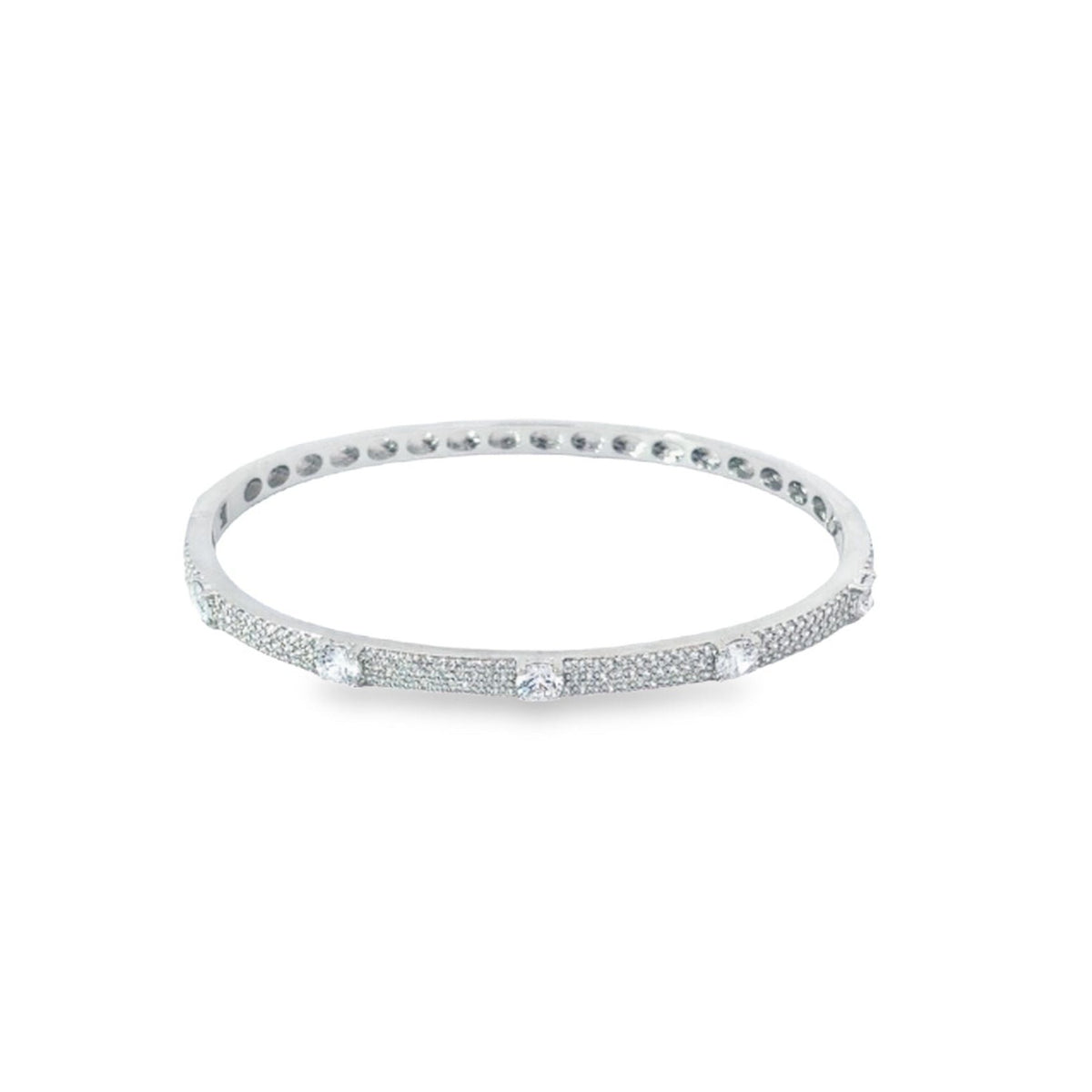 A shimmering silver diamond bangle bracelet sparkles against a clean white background.