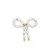 A delicate pearl bow brooch features lustrous rice pearls tied together with small gold accents against a clean white background.