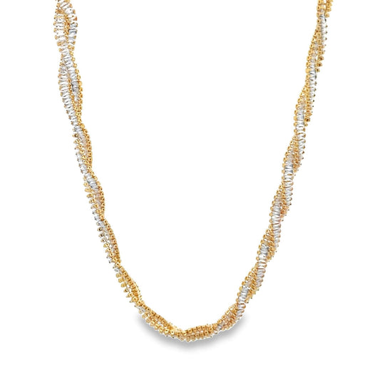 An elegant two-tone twisted gold necklace features interlocking strands of yellow gold and sparkling cubic zirconia stones against a clean white background.