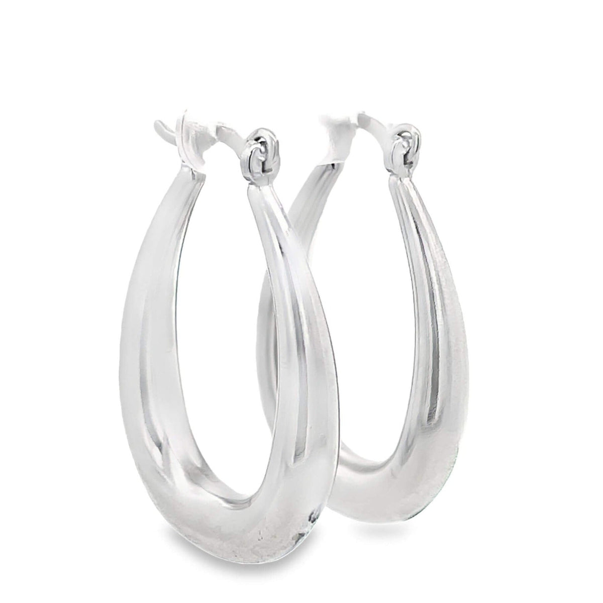 A pair of polished silver hoop earrings gleams against a clean white background.