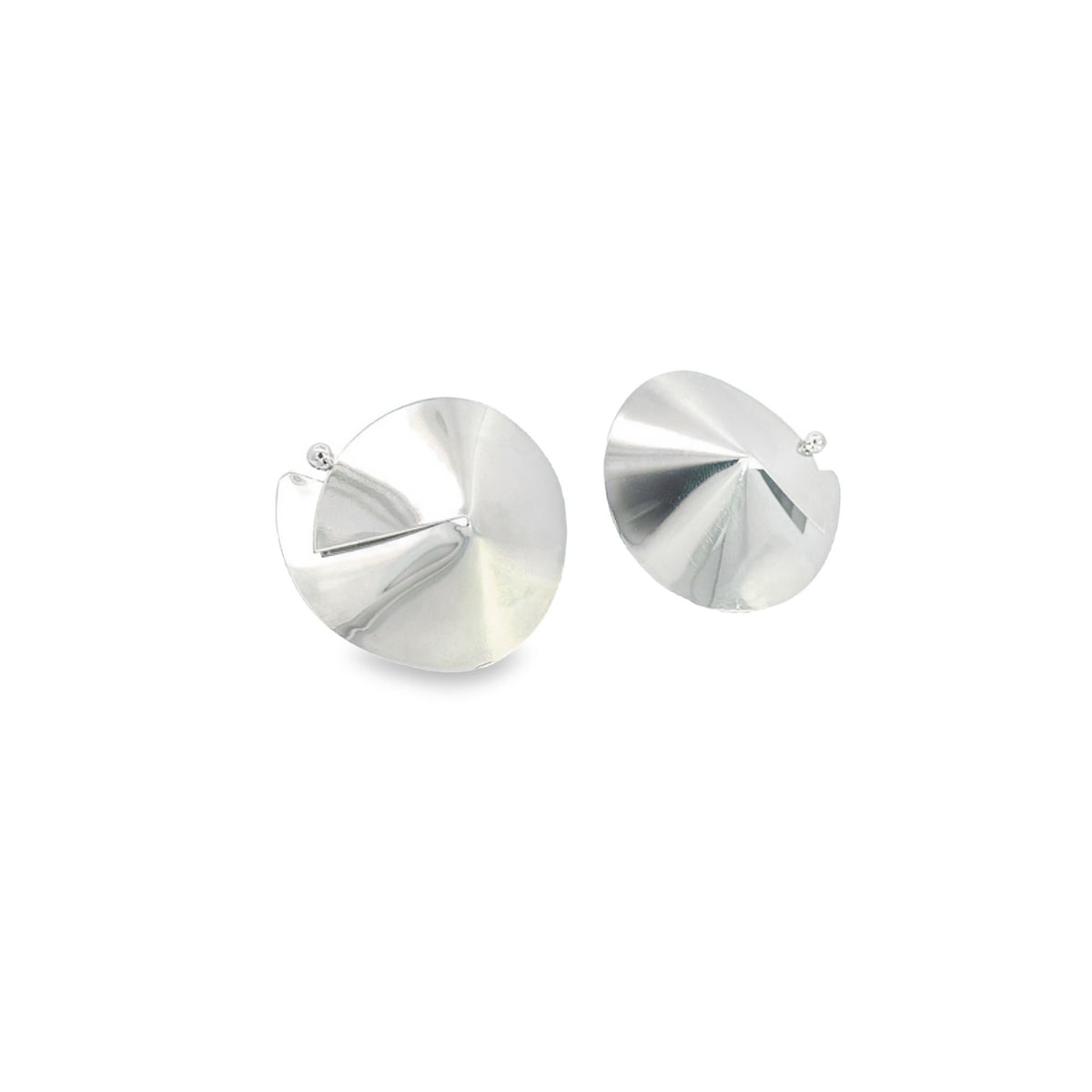 A pair of modern silver sculptural earrings rests against a clean white background.