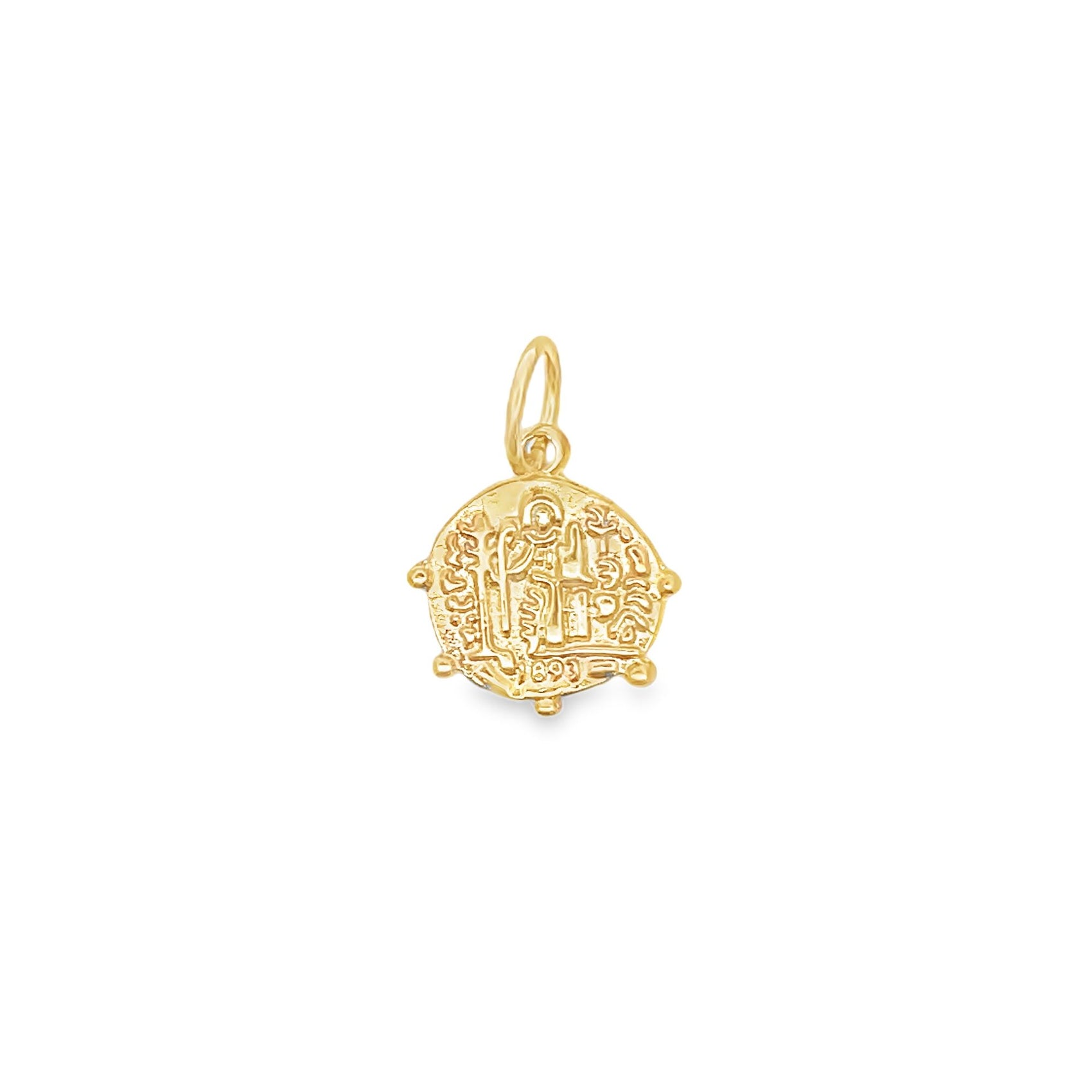 A detailed gold coin pendant hangs against a clean white background, showcasing intricate vintage religious engravings.