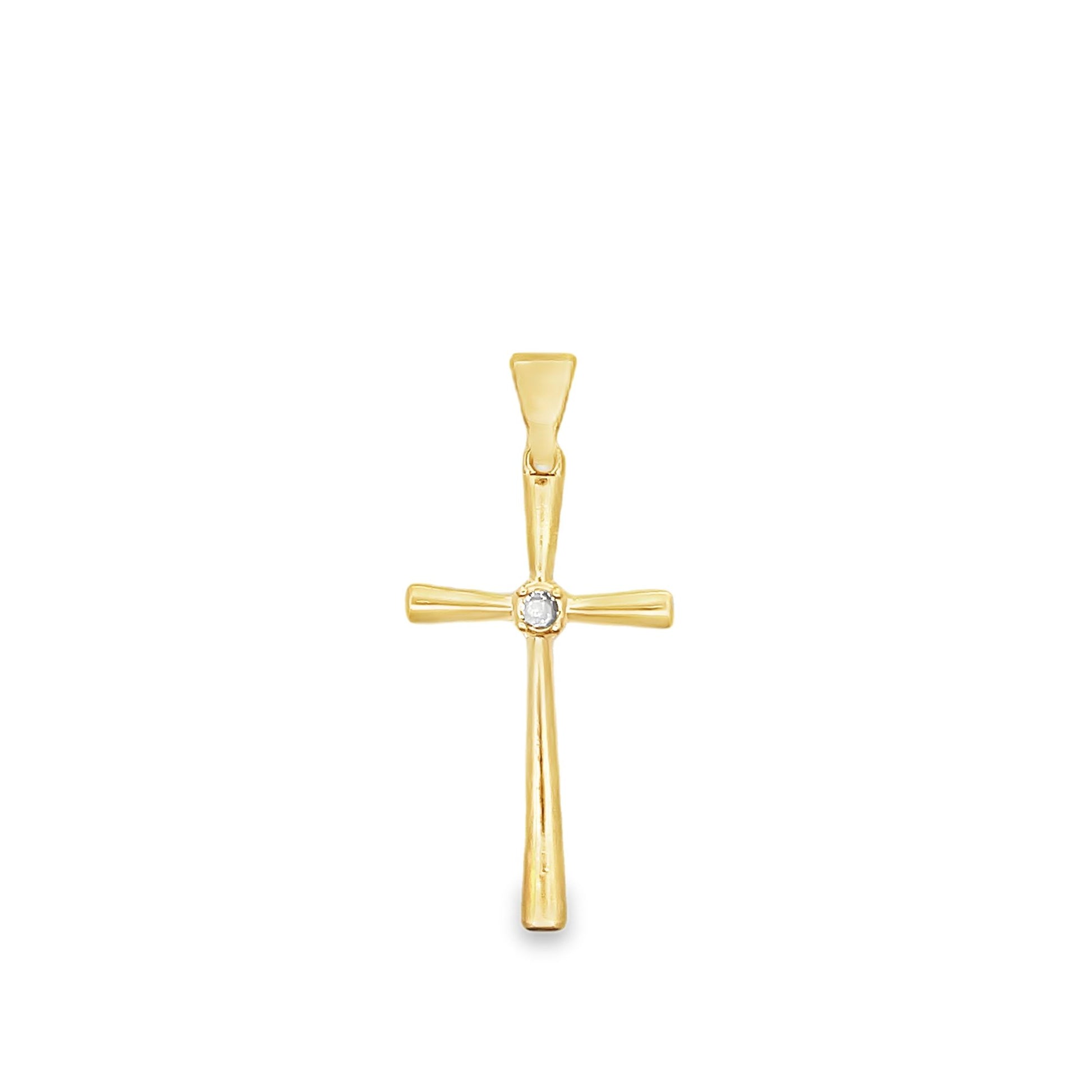 A gold cross pendant features a sparkling diamond set at the center against a clean white background.