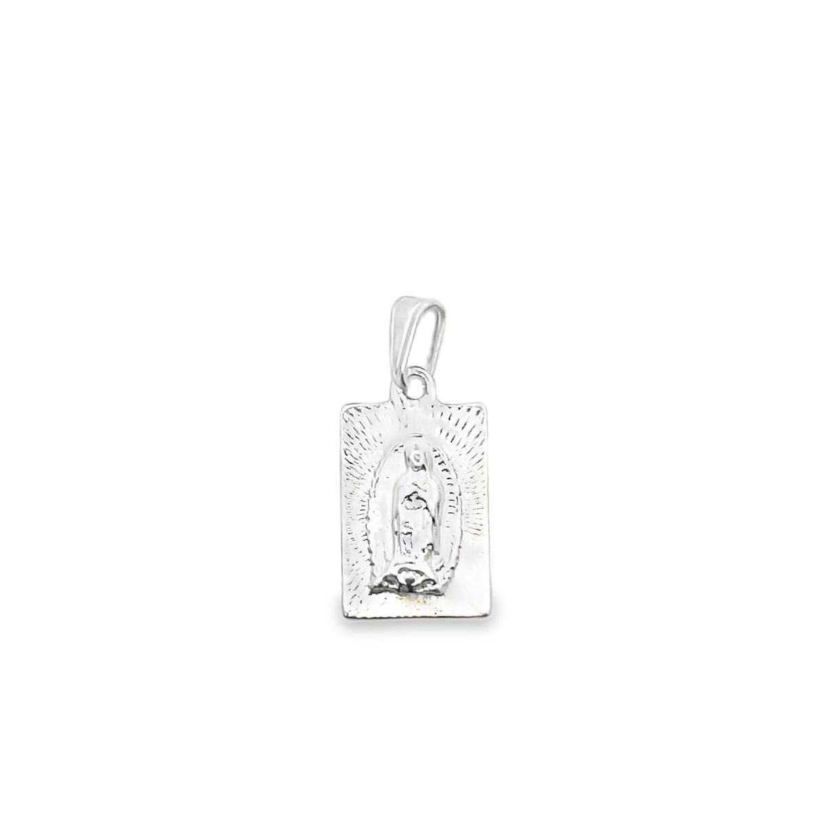A rectangular silver pendant depicts Our Lady of Guadalupe against a radiant, engraved background.