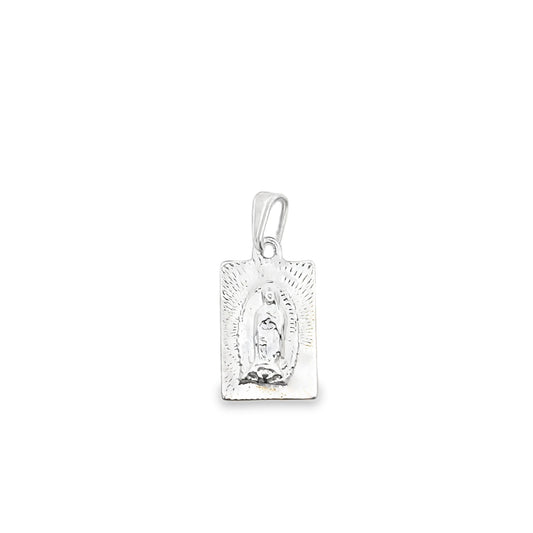 A rectangular silver pendant depicts Our Lady of Guadalupe against a radiant, engraved background.