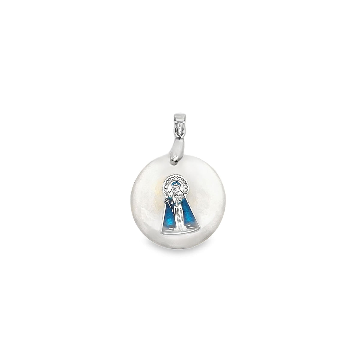 A round silver pendant features an enamel inlay of the Virgin of El Cisne in blue and white.