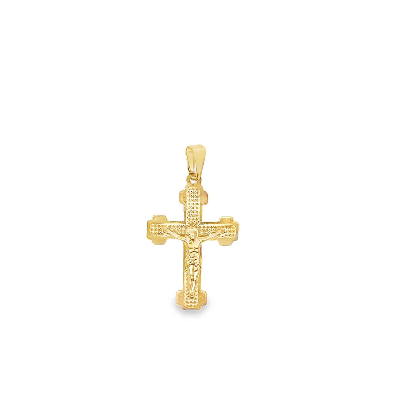 A detailed gold crucifix pendant featuring a textured surface hangs against a clean white background.