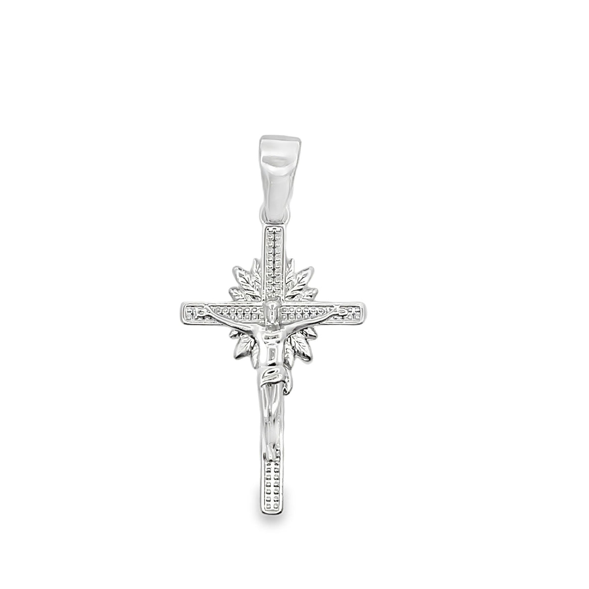 A polished sterling silver crucifix pendant displays an intricate depiction of Jesus on the cross against a sunburst background.