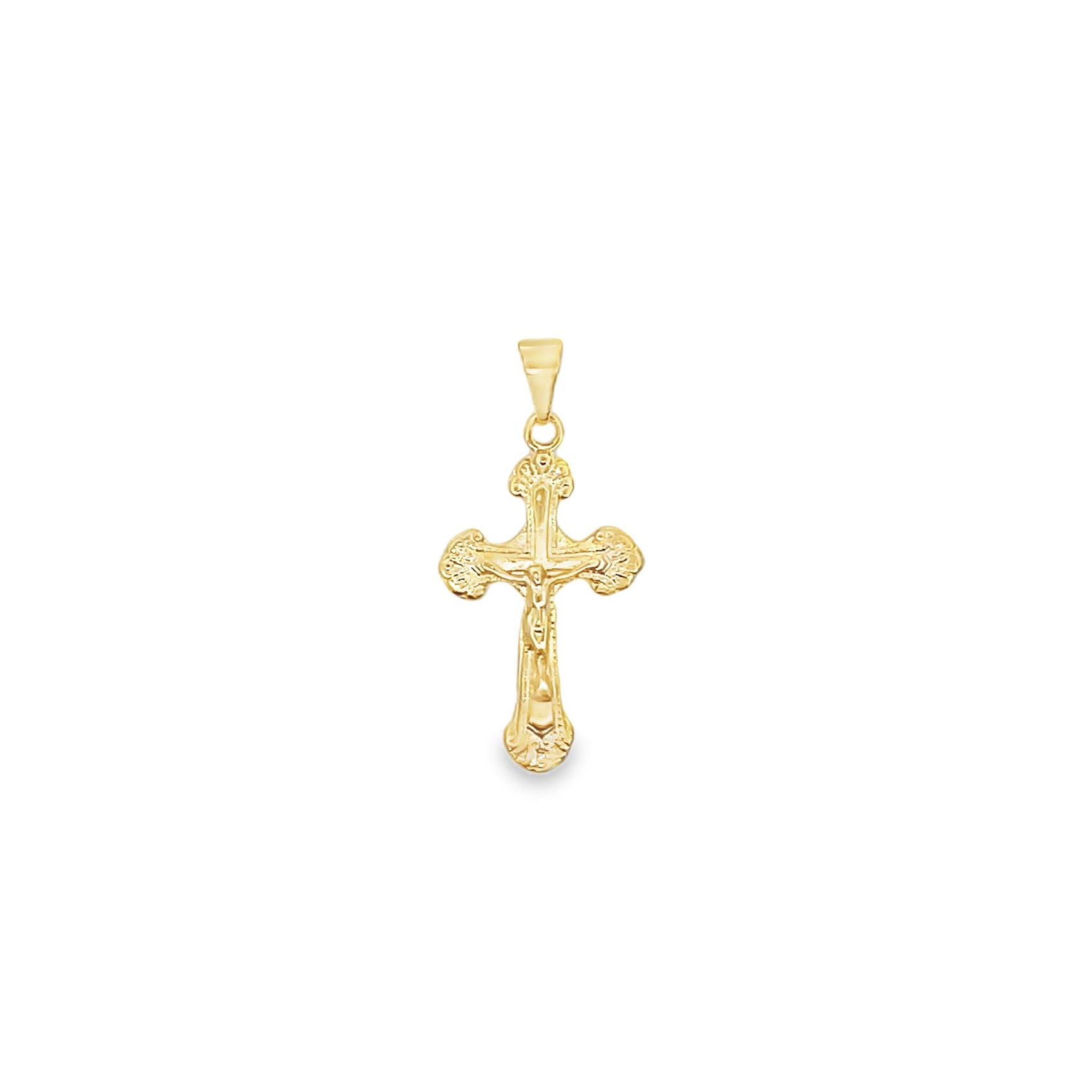 A detailed gold crucifix pendant features an ornate, textured design with a delicate figure of Jesus.