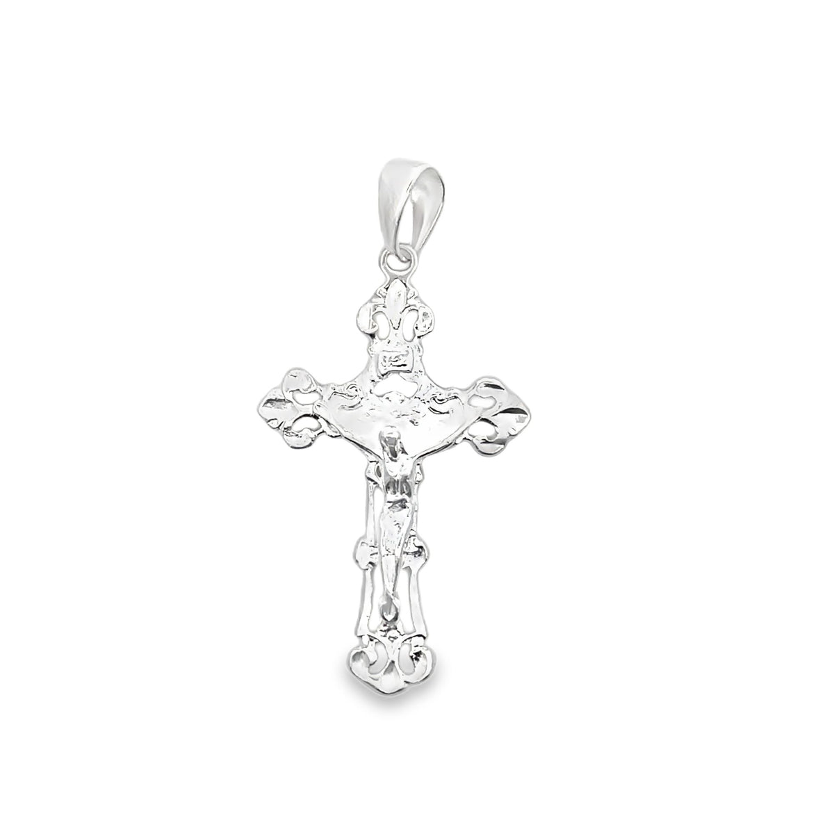 A polished silver crucifix pendant displays intricate decorative details against a plain white background.