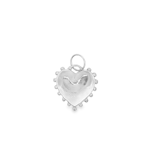 A shiny silver heart pendant features a beaded border and a bail ring at the top.