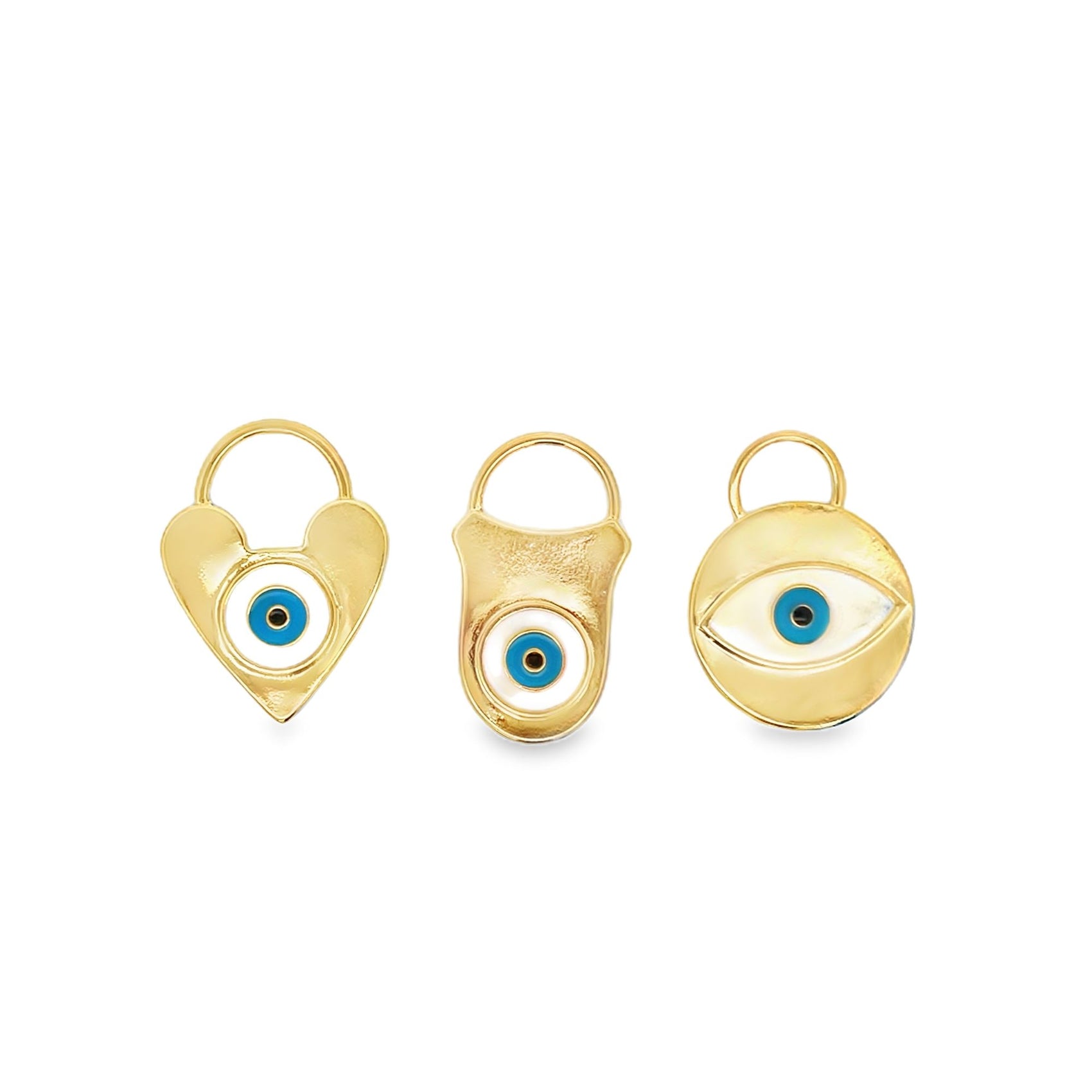 Three gold evil eye charms in heart, rectangular, and round shapes display blue and white enamel details against a white background.