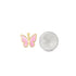 A gold and pink enamel butterfly pendant rests next to a dime for size comparison.