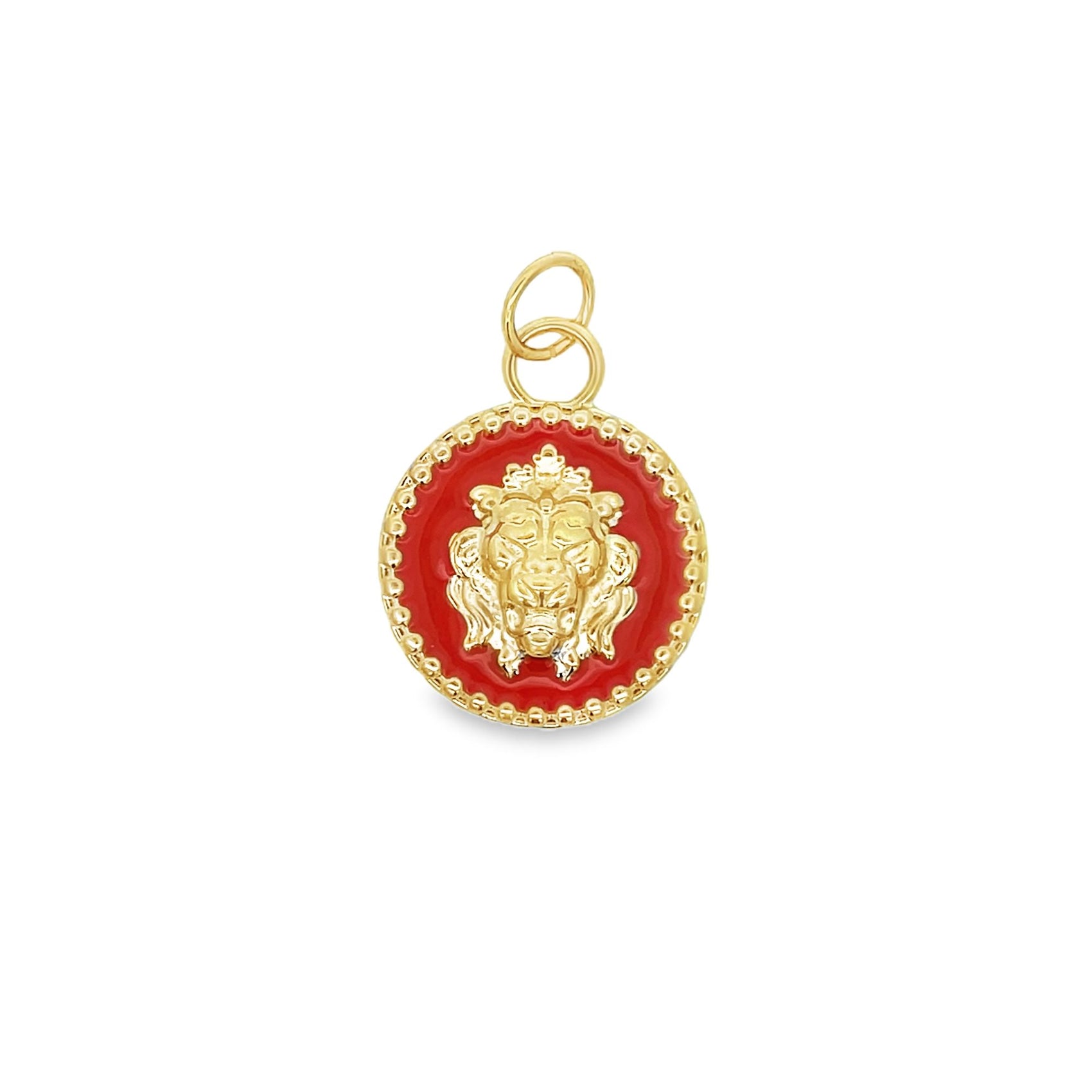 A round gold pendant features a detailed lion head motif centered against a vibrant red enameled background.