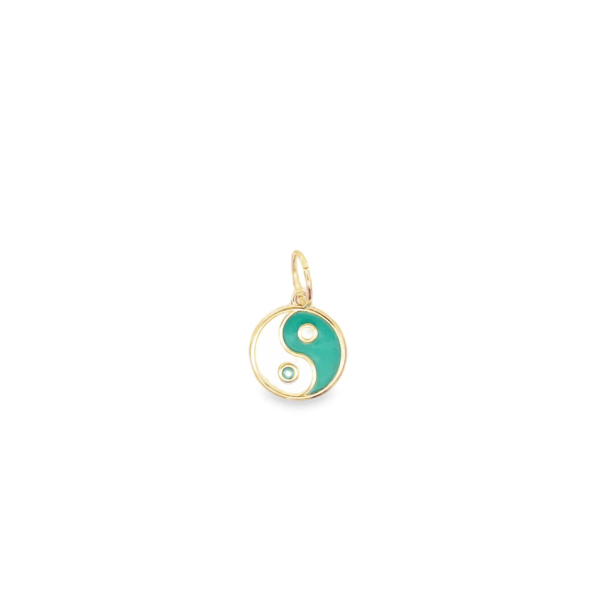 A gold and enamel yin yang charm pendant displays a turquoise and white design against a plain white background.