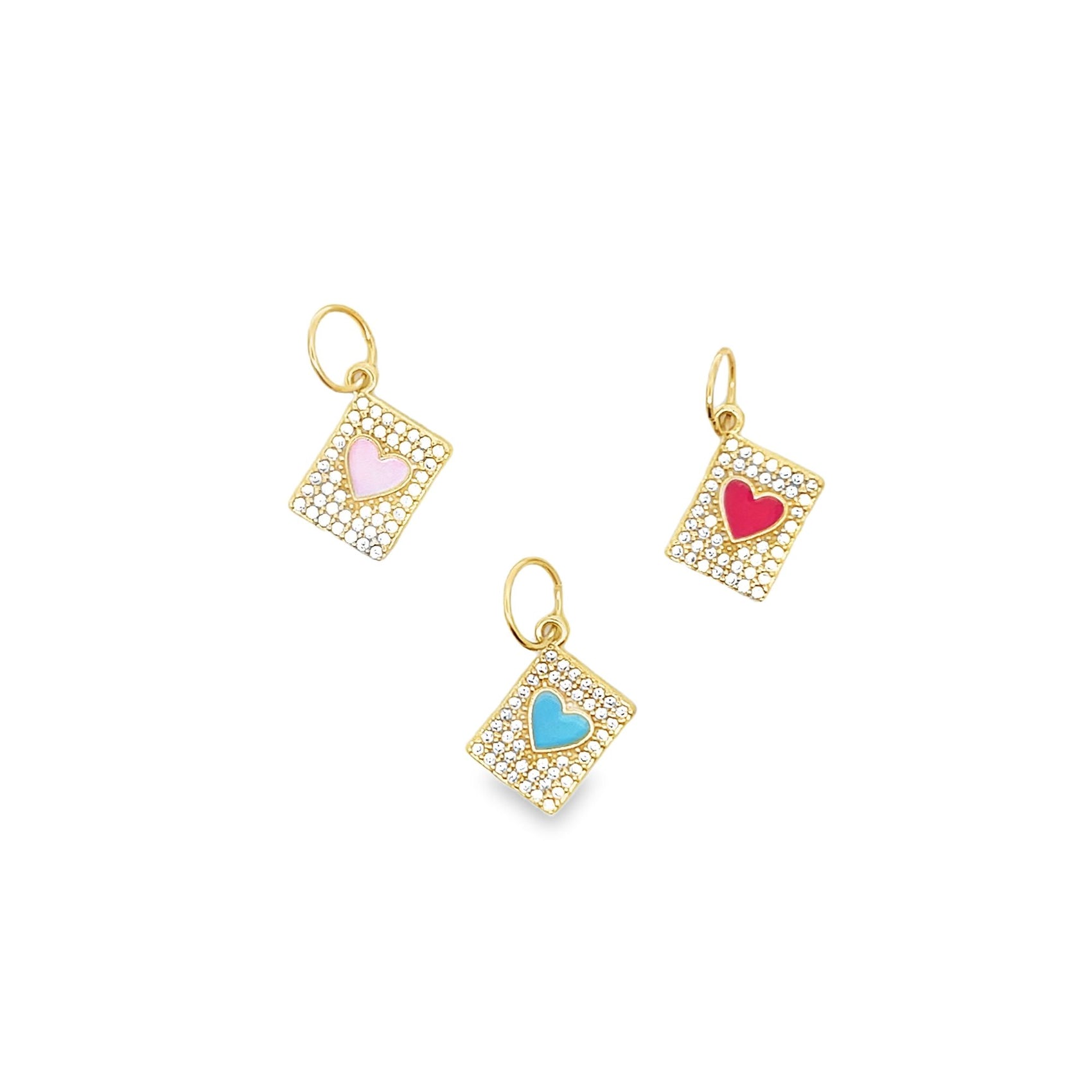 Three gold diamond-encrusted envelope pendants featuring pink, blue, and red enamel hearts display against a plain white background.