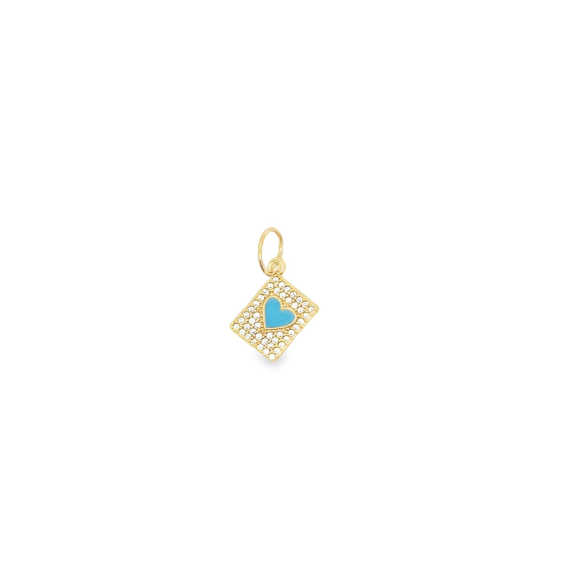 A gold diamond-pave charm features a bright turquoise enamel heart in the center against a white background.