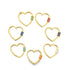 Seven gold heart-shaped carabiner jewelry clasps with colorful enamel details arranged in a circle against a white background.