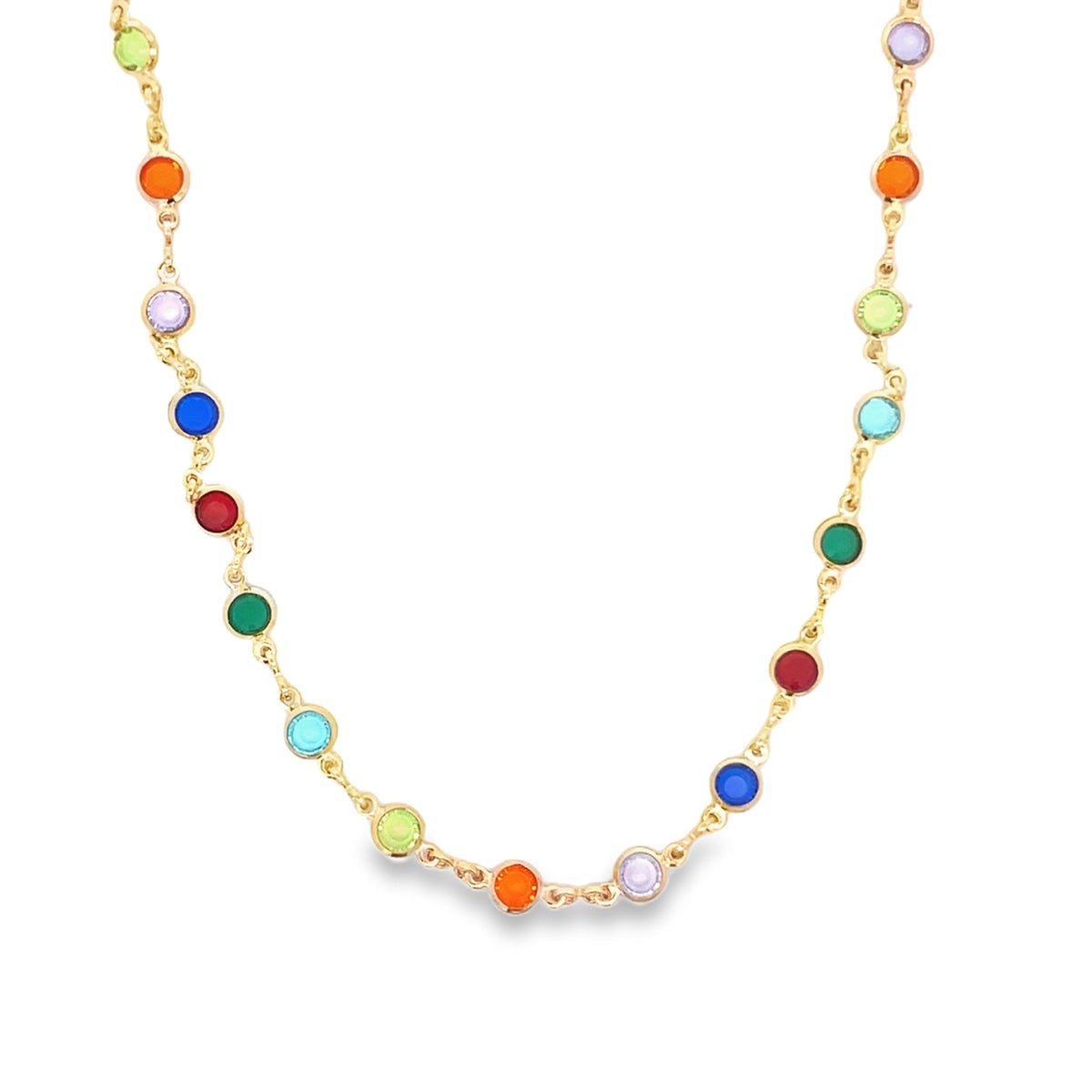 A delicate gold chain necklace sparkles with multicolored, bezel-set crystal stones.