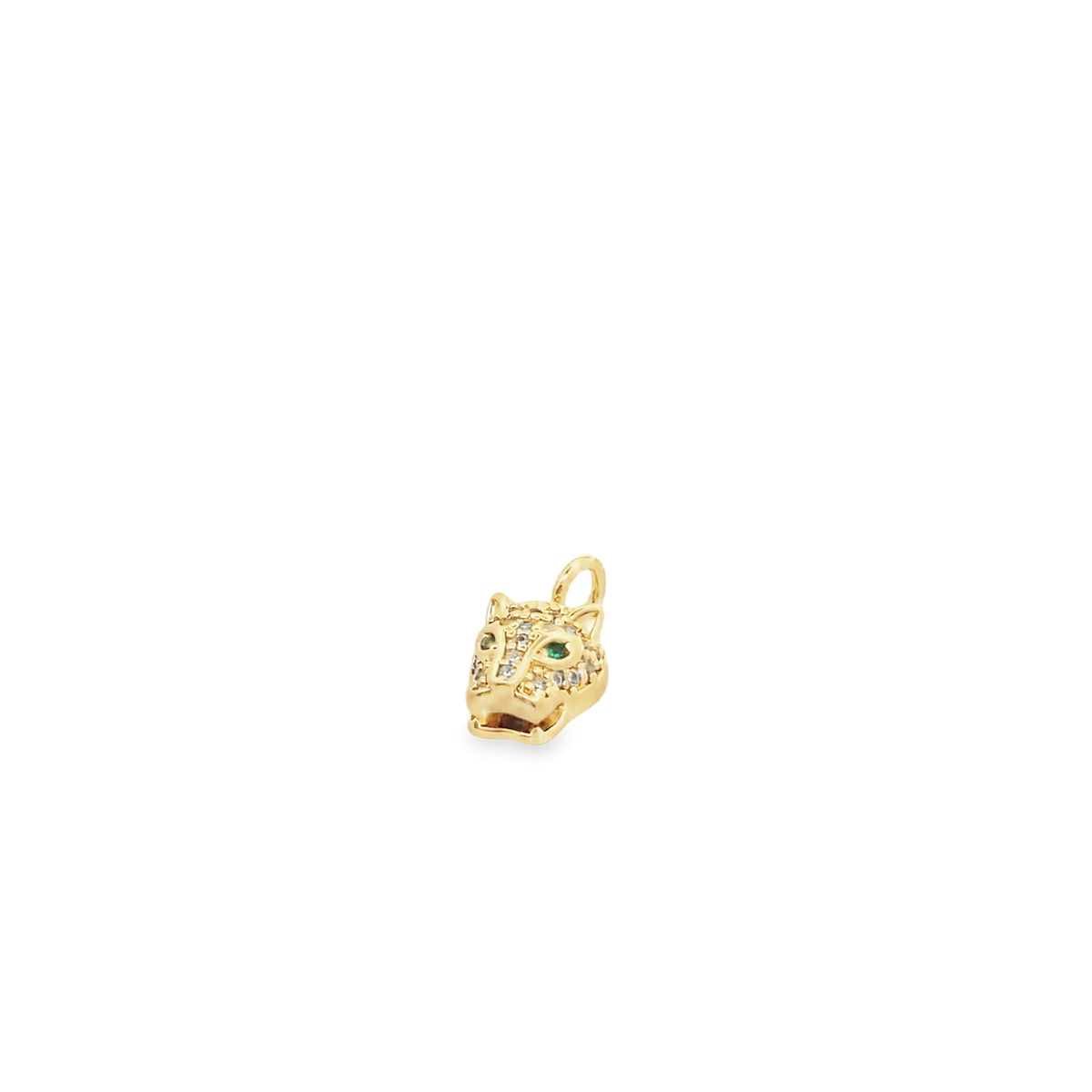 A gold panther charm pendant sparkles with pave diamonds and a vibrant green emerald eye against a clean white background.