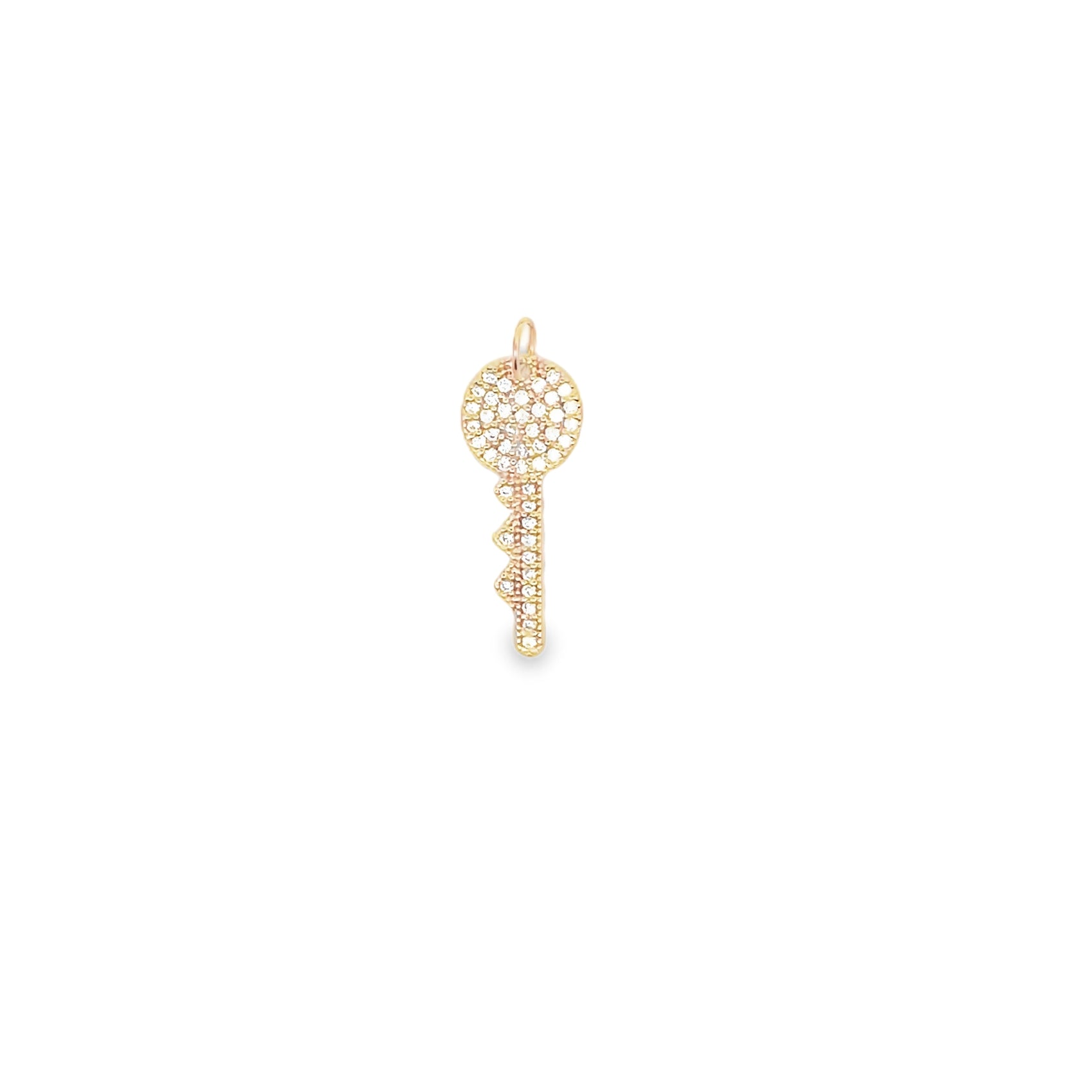 A gold key pendant encrusted with sparkling diamonds dangles against a clean white background.