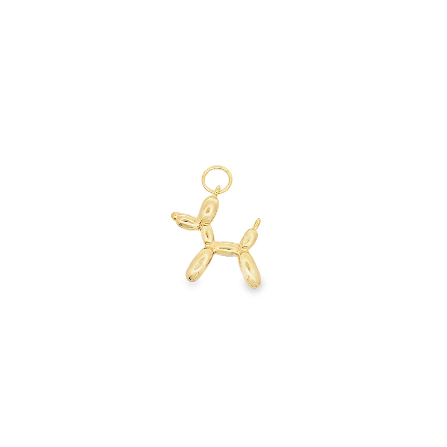 A shiny gold balloon dog pendant hangs from a small jump ring against a plain white background.