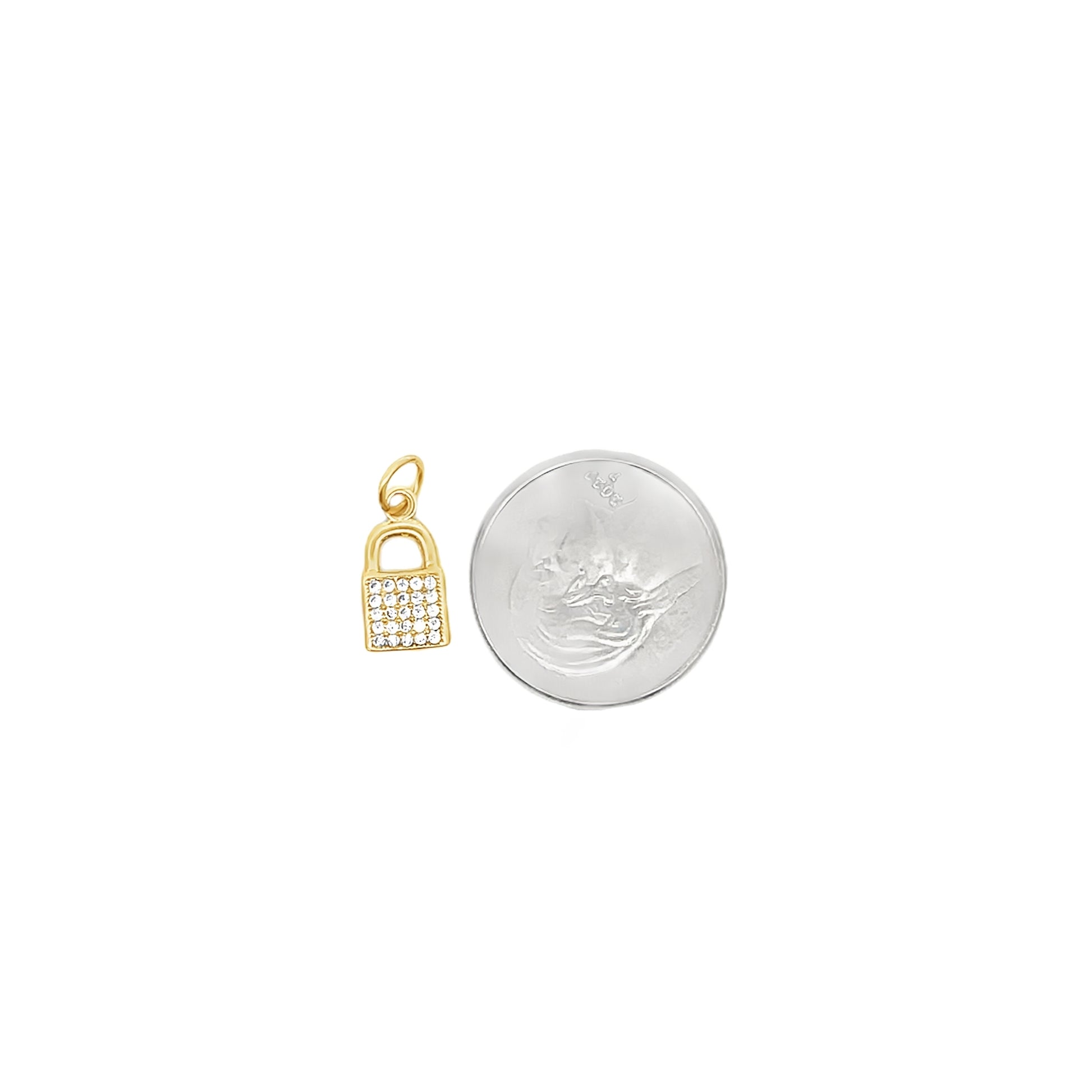 A small gold padlock charm encrusted with cubic zirconia stones rests next to a coin for scale.