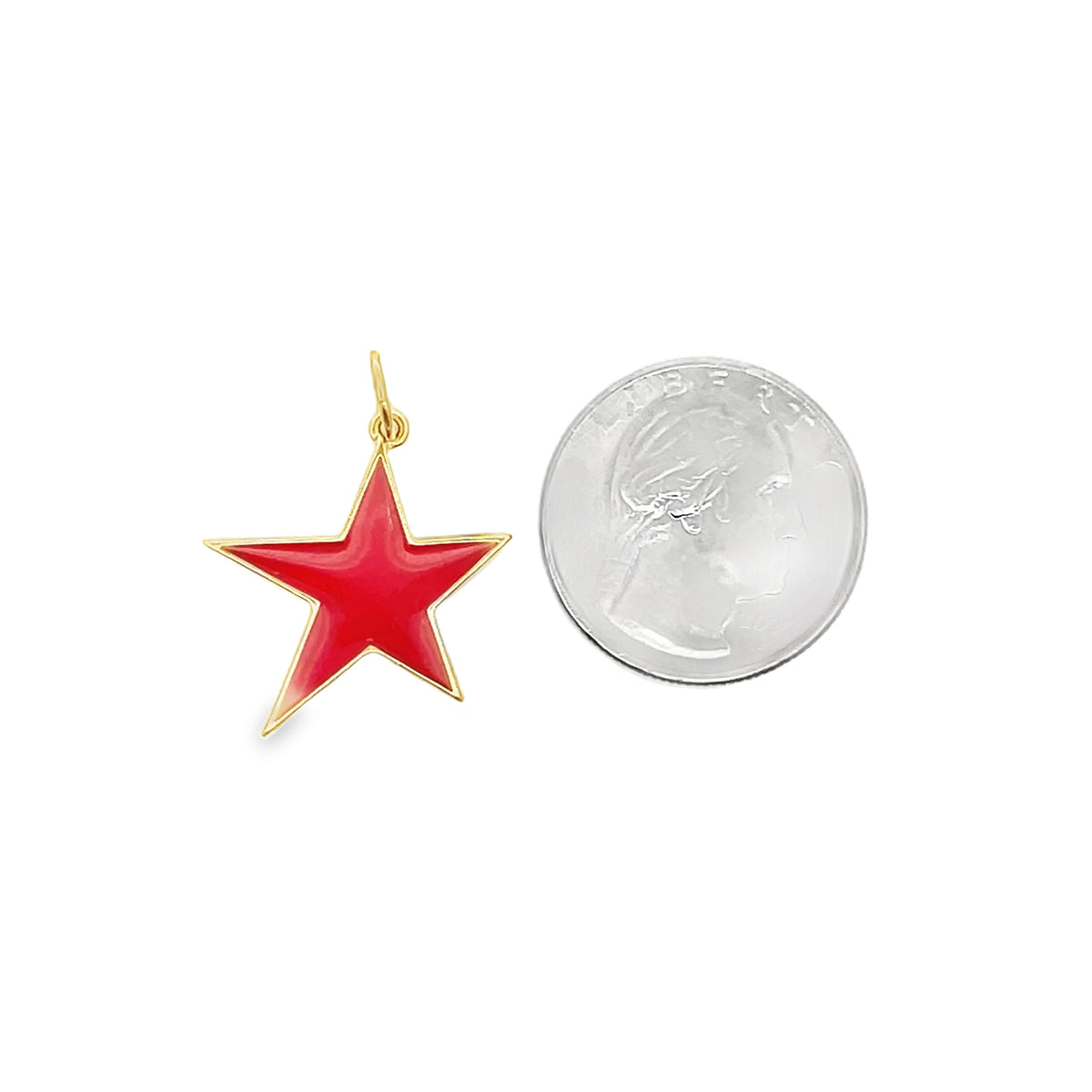 A red enamel star charm sits next to a US quarter coin to display its actual size.
