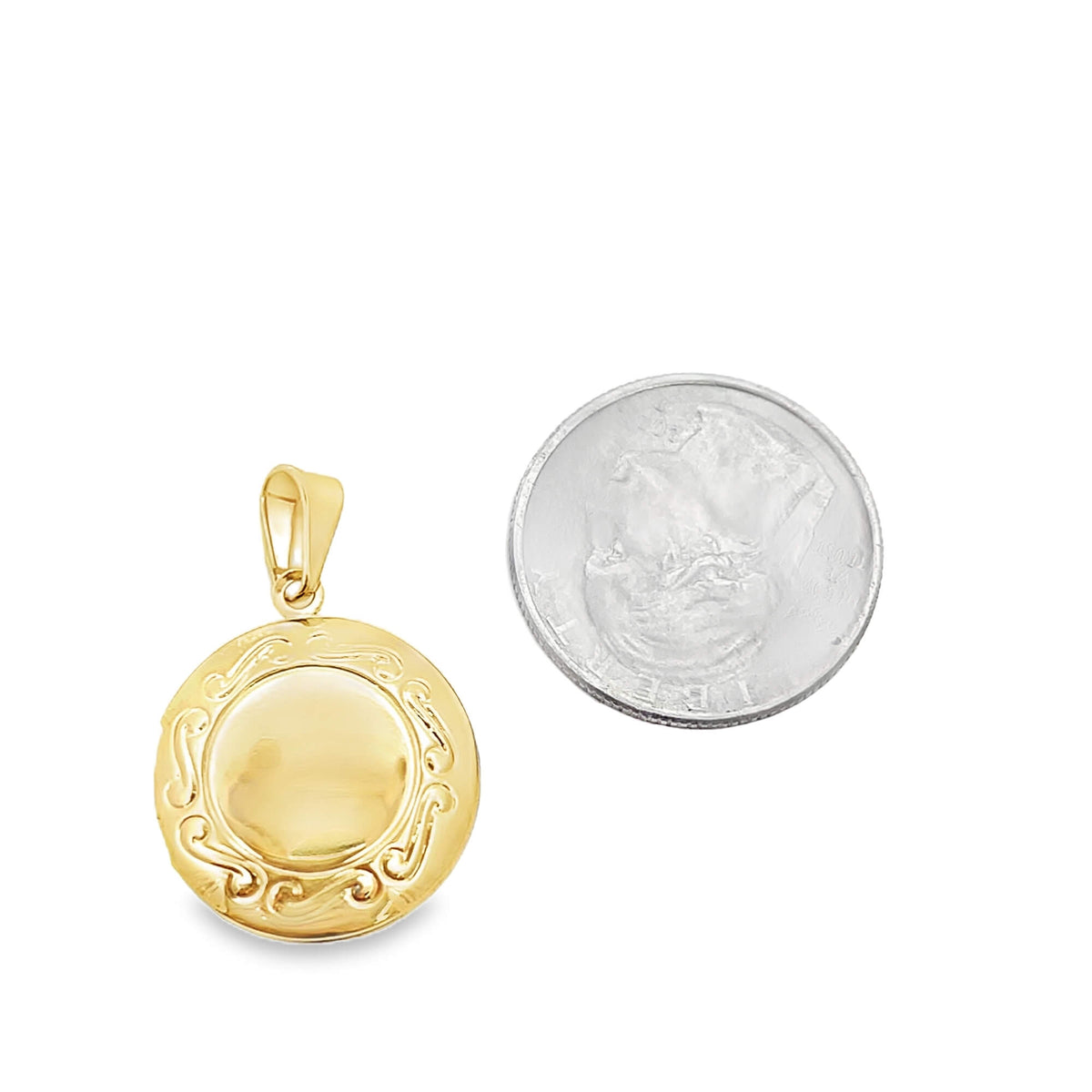 A round gold locket pendant sits next to a US dime for size comparison.