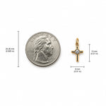 Minimalist cross charm with a bezel-set round cubic zirconia center. Crafted in 18K Gold Filled and Rhodium for necklaces, bracelets, and hoop earrings.
