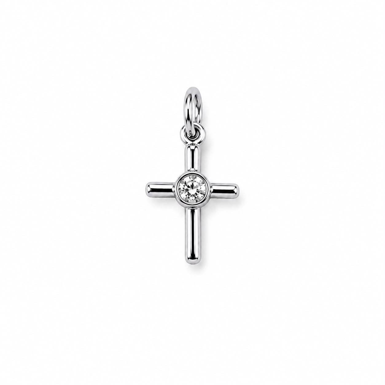 Minimalist cross charm with a bezel-set round cubic zirconia center. Crafted in 18K Gold Filled and Rhodium for necklaces, bracelets, and hoop earrings.