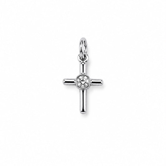 A polished silver cross pendant sparkles with a bezel-set diamond at its center against a white background.