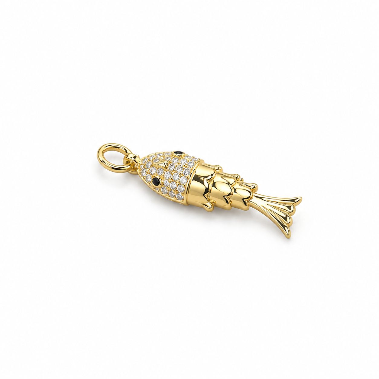 A gold fish pendant shines against a plain white background, featuring a pavé-set crystal head with black stone eyes and smooth, polished fins.