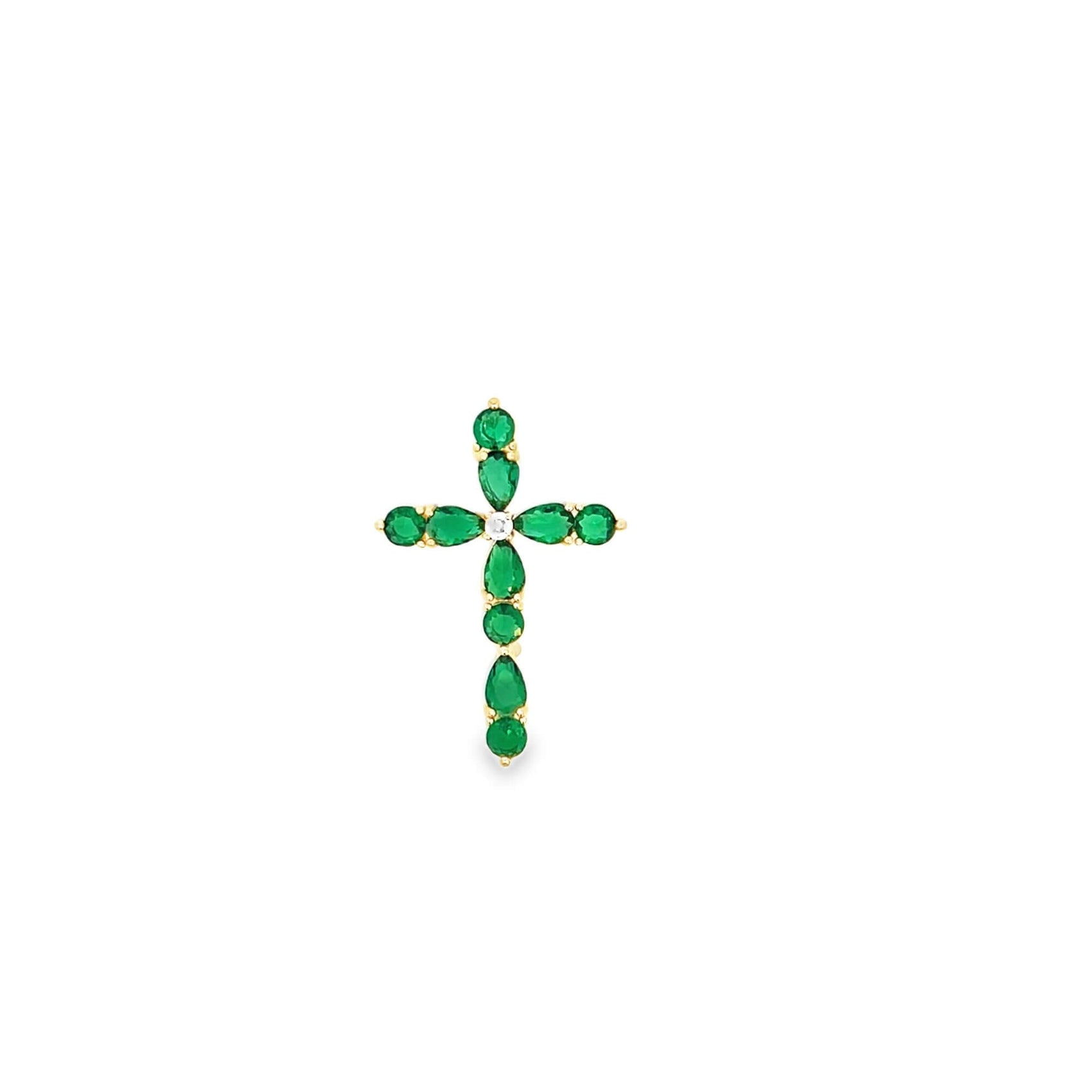 A delicate gold cross pendant features vibrant green emerald gemstones and a single sparkling diamond at the center.
