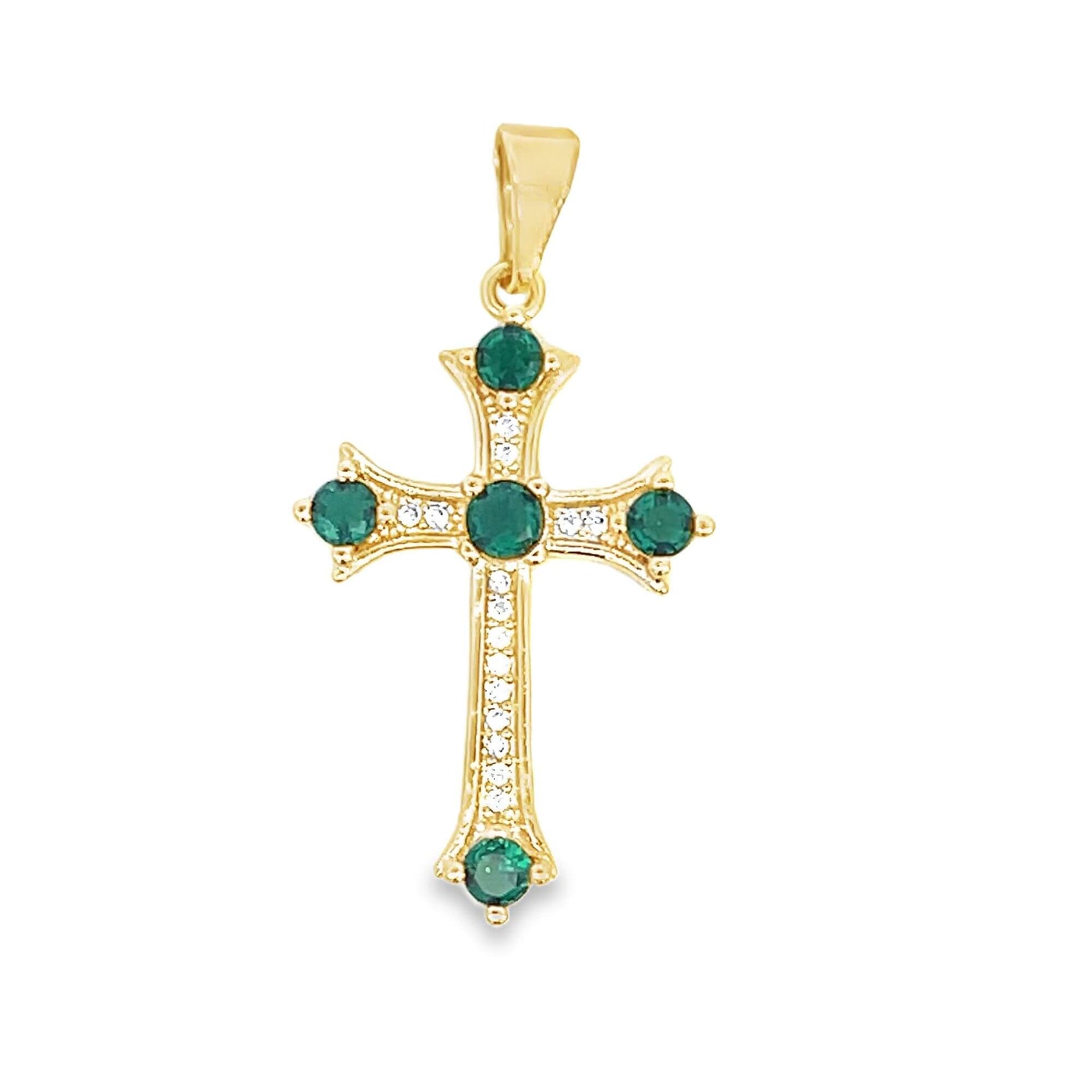 A gold cross pendant features brilliant green emerald stones at its center and tips, accented with sparkling white diamonds.