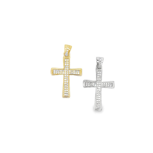 Two diamond-encrusted cross pendants, one in gold and one in silver, rest side by side against a clean white background.