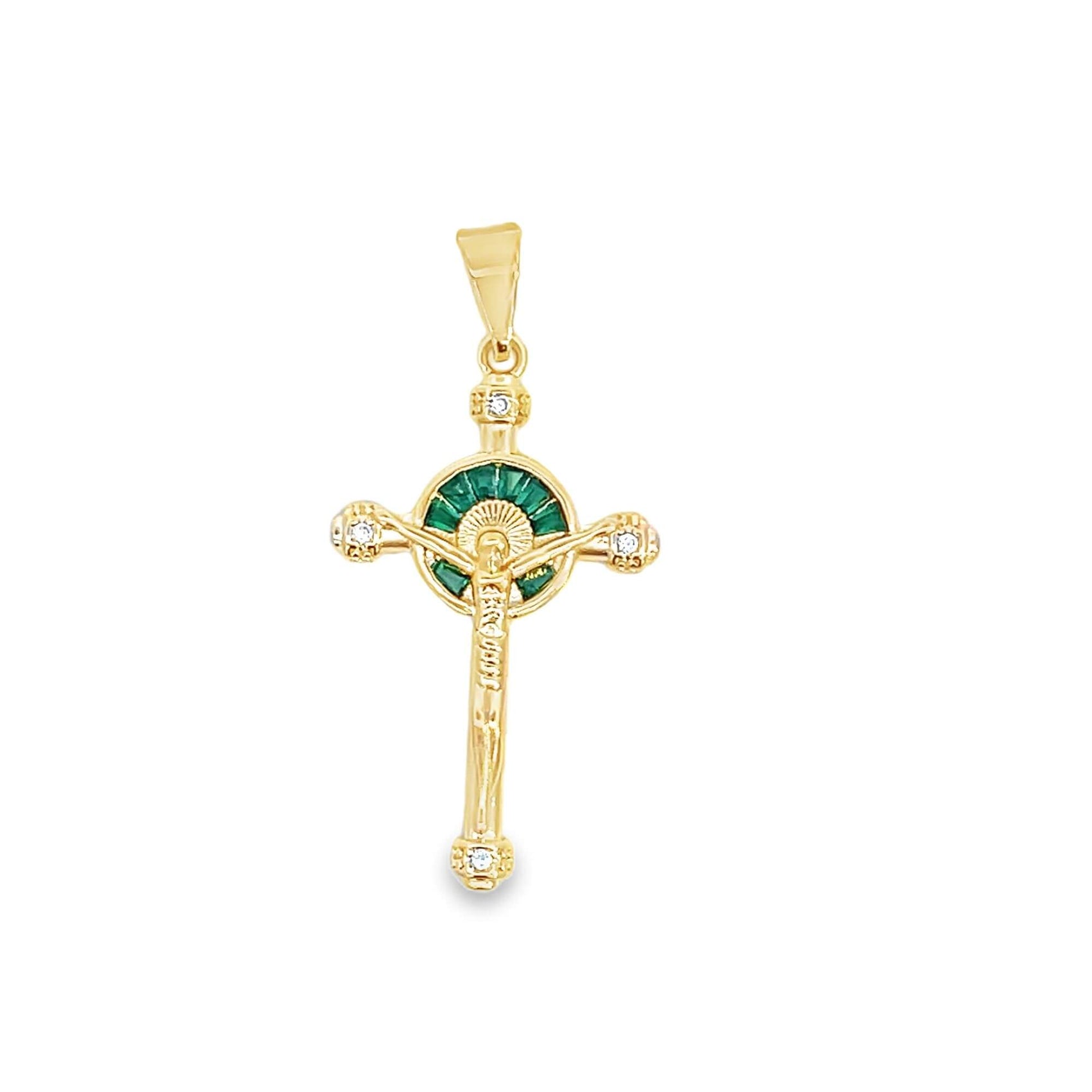 A gold crucifix pendant features sparkling diamond accents and a vibrant green emerald halo framing the center.