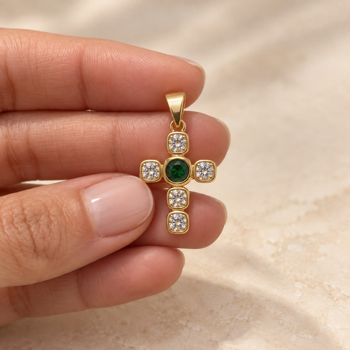 Shop a 18K Gold Filled cross pendant featuring a colorful center stone and sparkling clear CZ accents. Available in multiple stone color options.