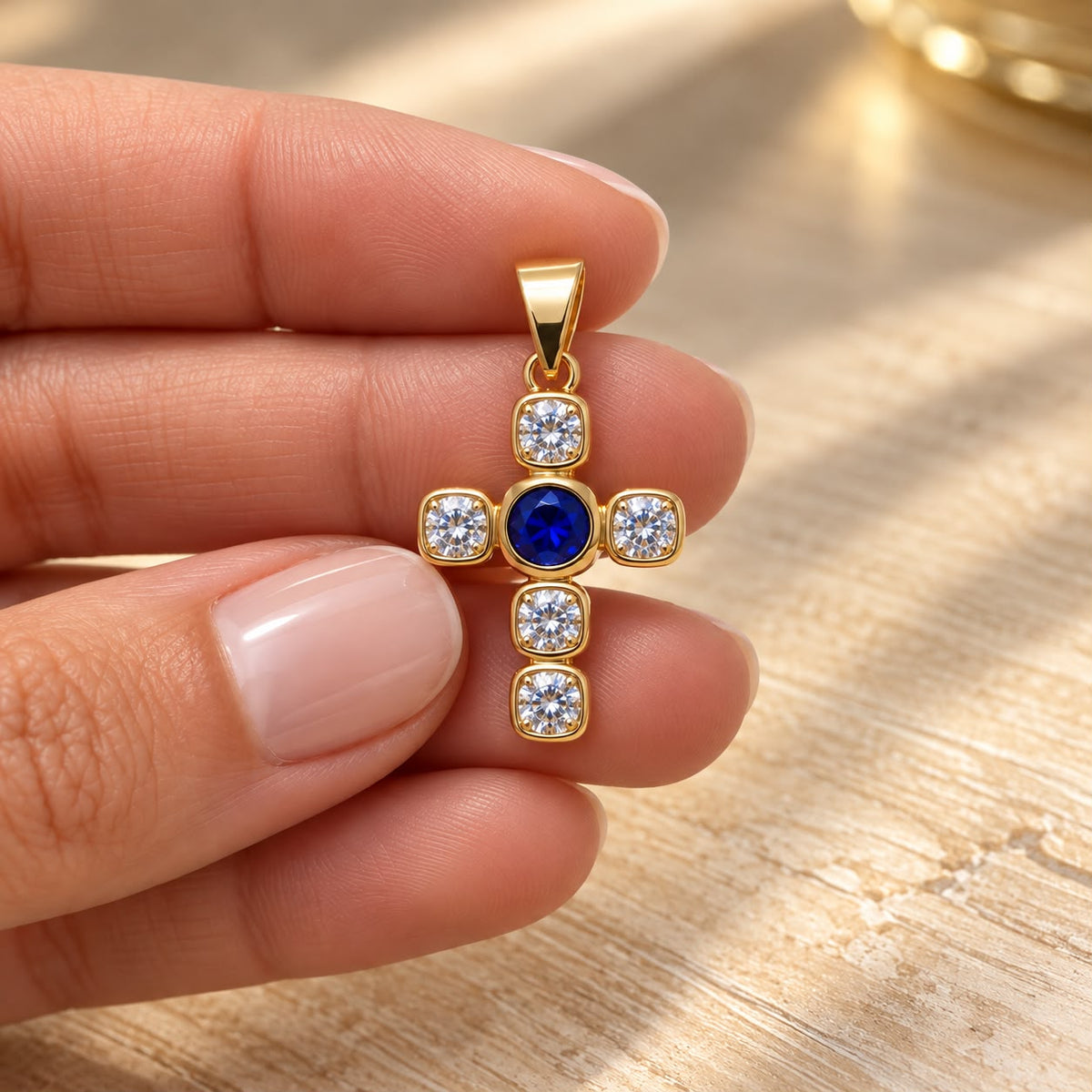 Shop a 18K Gold Filled cross pendant featuring a colorful center stone and sparkling clear CZ accents. Available in multiple stone color options.